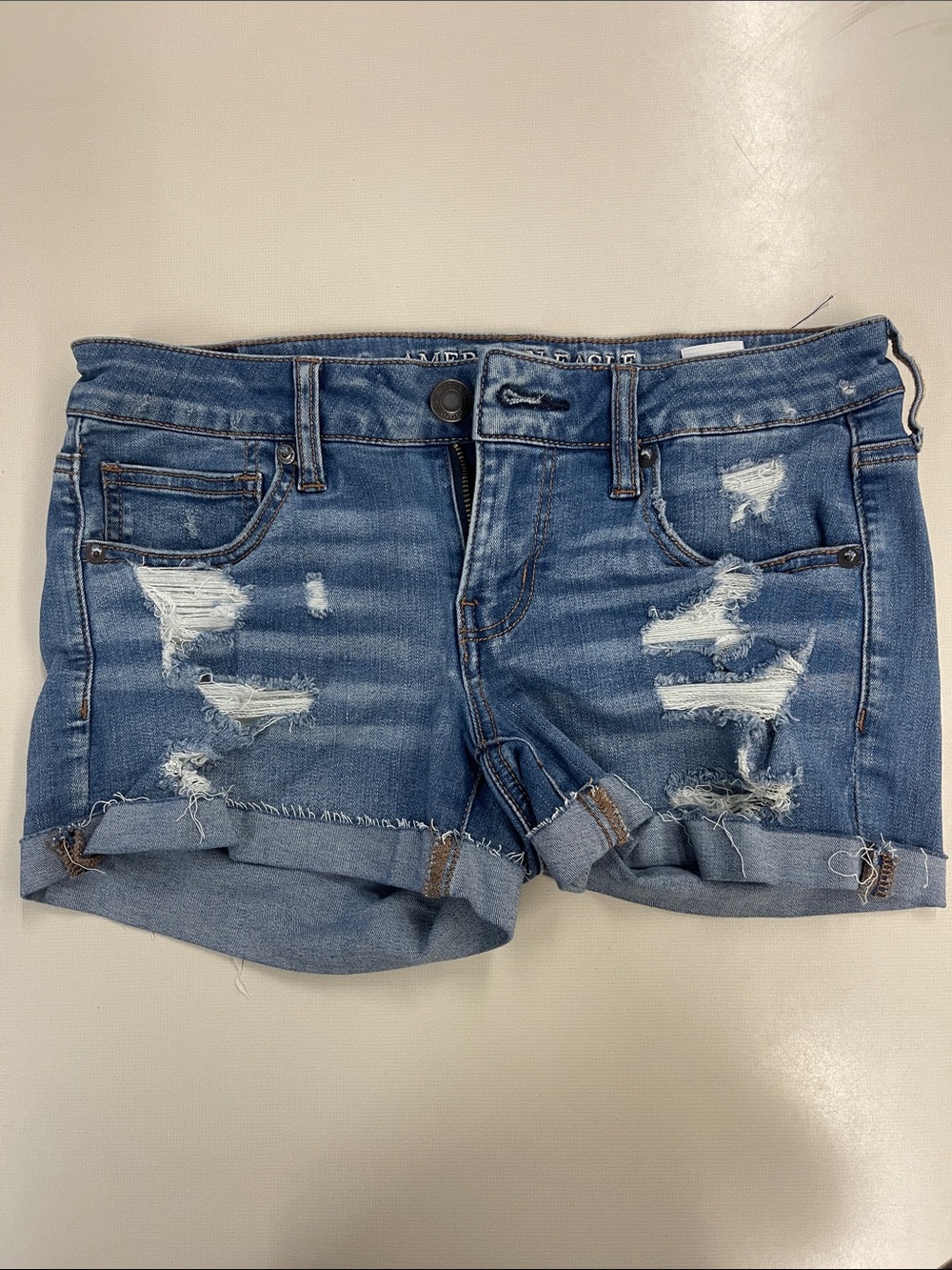 Distressed Blue Denim Roll-Cuff Women’s Shorts